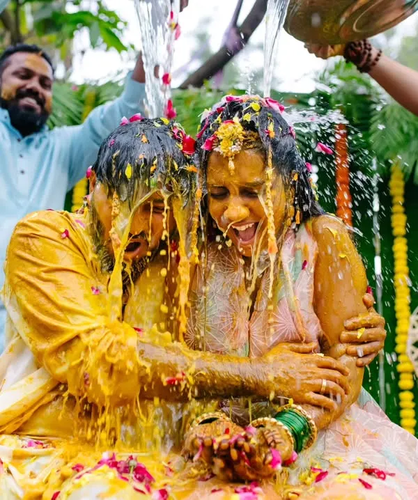 This is what pure, uninhibited joy looks like. I live for capturing these high-energy, candid moments during a Haldi ceremony where everyone lets loose and celebrates.