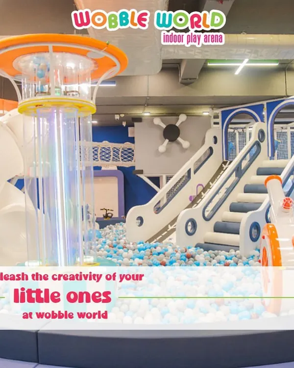 A wide view of our main play structure. This shot shows the multi-level climbing areas, slides, and the central ball pit, all designed to unleash your child's creativity and energy.