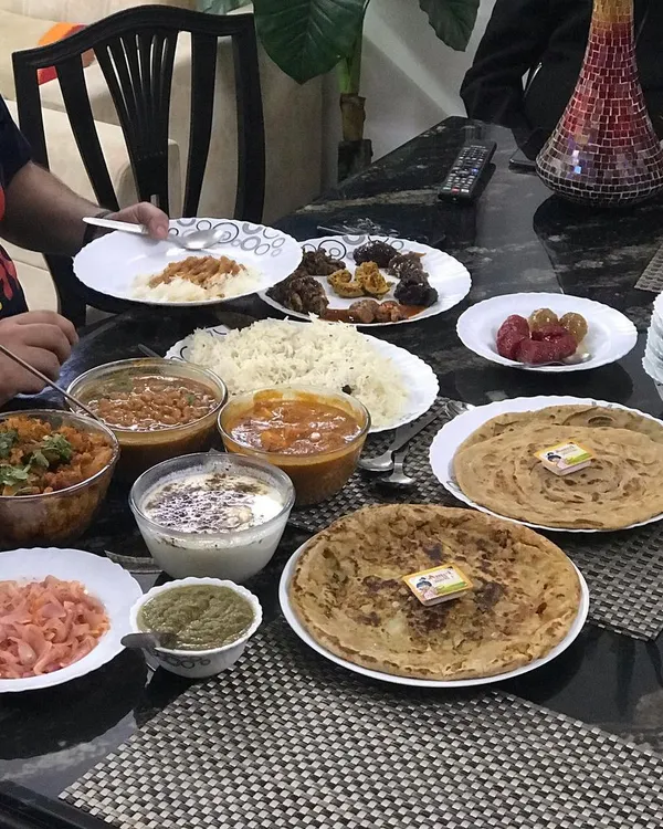 This is what our food is all about: a table full of delicious, home-cooked Punjabi dishes, ready to be shared. It’s the feeling of a family meal, delivered right to you.
