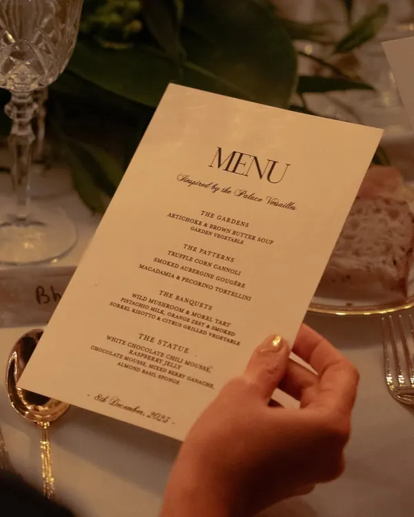 The menu is the first chapter of the story. For our Versailles-inspired dinner, the menu was designed with elegant typography, outlining the four acts of the meal: The Gardens, The Patterns, The Banquets, and The Status.