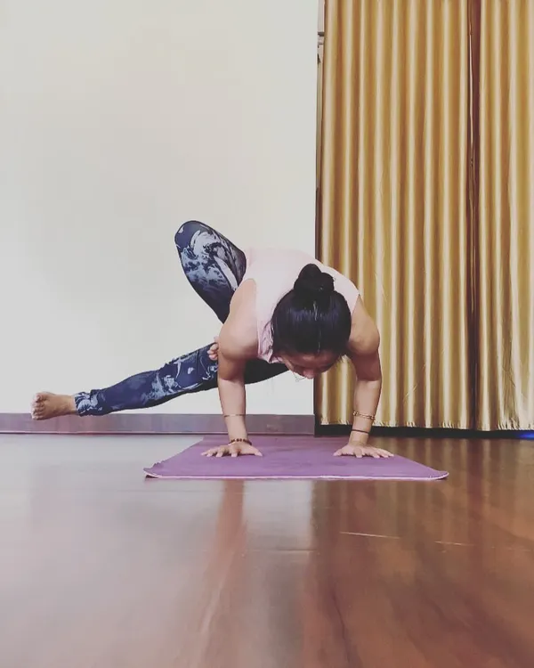 Finding my balance in Parsva Bakasana, or side crow. This pose is a great way to build wrist and core strength, and we break it down into manageable steps in class.