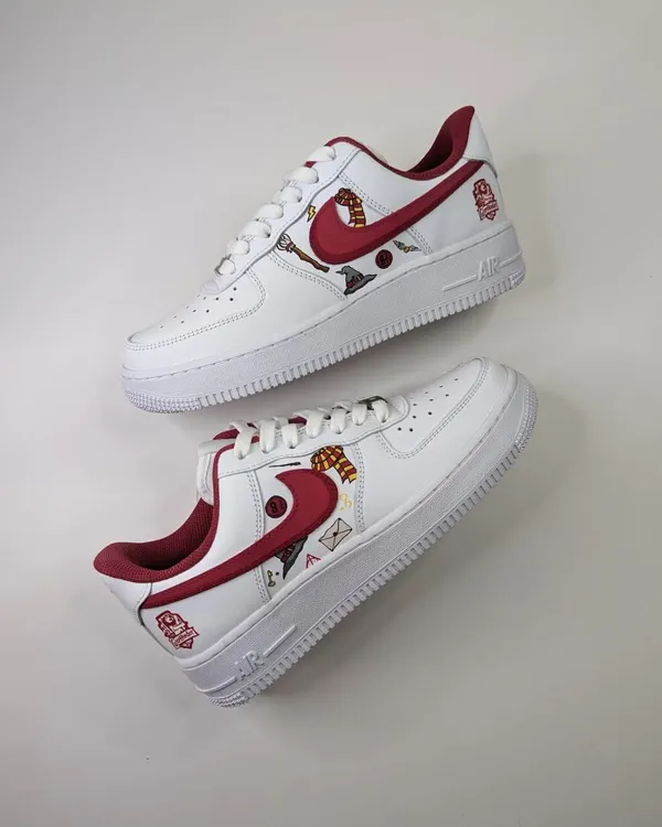 A custom pair of Gryffindor-themed Air Force 1s, featuring various motifs from the Harry Potter world like the sorting hat, a broomstick, and even Dobby.