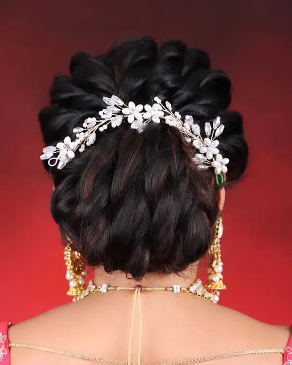 A detailed view of an elegant and intricate bridal bun. This is one of the 10 professional hairstyles that I teach in my 30-day course, perfect for brides and special occasions.