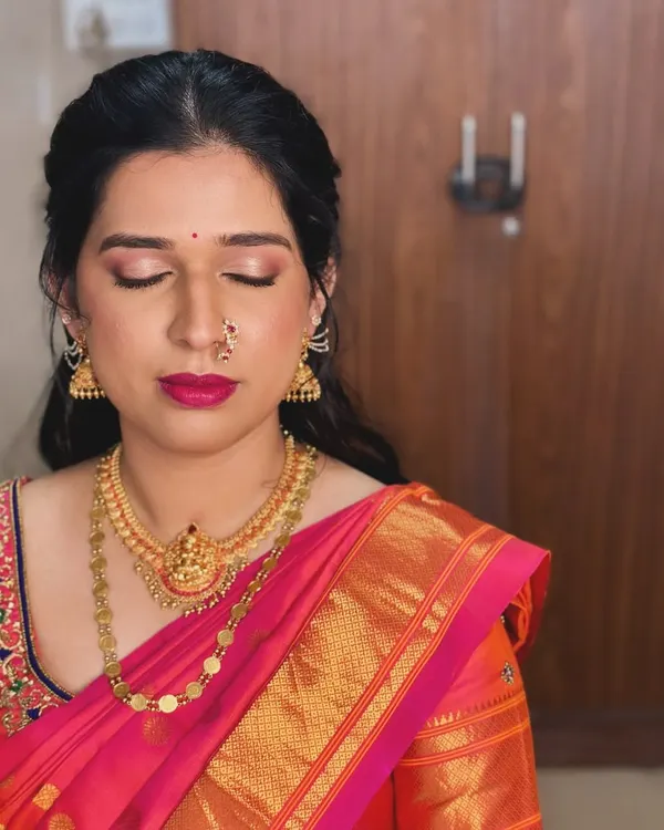 For Anusha's engagement, we created this beautiful look with a focus on shimmering pink eyeshadow and a matching bold lip.
