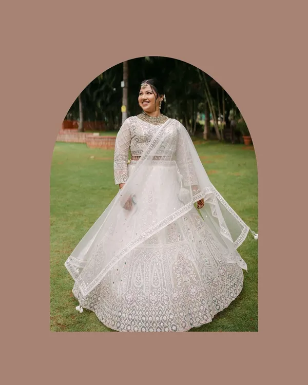 A beautiful portrait of the bride-to-be, radiant in her white engagement lehenga. We take the time to capture these solo shots, celebrating the individual before they become part of a pair.