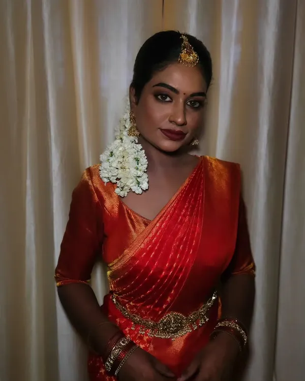 Radiant in tradition. For this stunning bridal look, I embraced the beauty of her dusky, highly pigmented skin with a flawless matte finish. The deep reds and golds create a regal and timeless vibe.