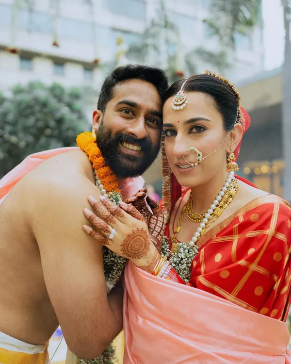 A beautiful portrait of a South Indian bride and groom, capturing their joy and traditional attire.