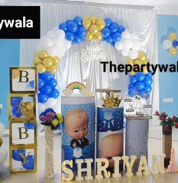 A fun Boss Baby theme for a "Naam Karan" or naming ceremony. The blue, white, and gold balloons, along with character cutouts and themed "BABY" blocks, make it a stylish celebration.