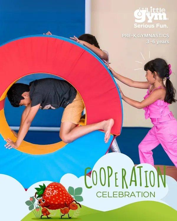 It takes a team. Children work together to move our large, soft wheel, learning valuable lessons in cooperation and problem-solving.