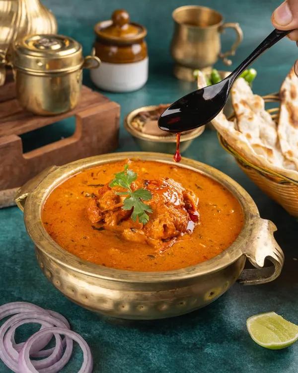 I love capturing action in my stills. That final drizzle of chili oil over a rich Indian curry adds drama and makes the dish come alive, highlighting the texture and colour.