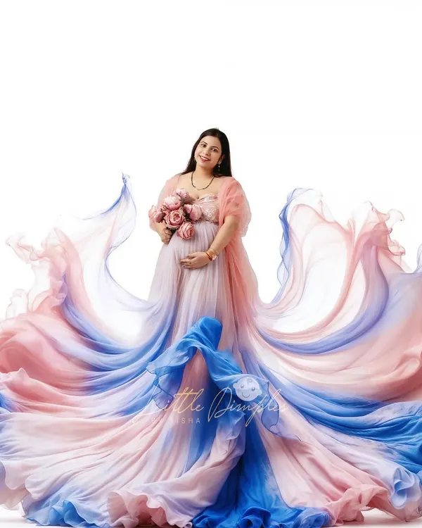 This is what maternity dreams are made of. I love creating these grand, flowing gown portraits in my studio, using fabric and light to celebrate your journey in the most beautiful way.