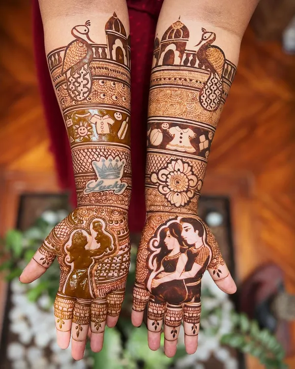 A beautiful baby shower mehendi telling the story of the parents-to-be. This design features a silhouette of the couple, their baby's name 'Lucky', and adorable motifs like baby clothes and traditional peacocks.
