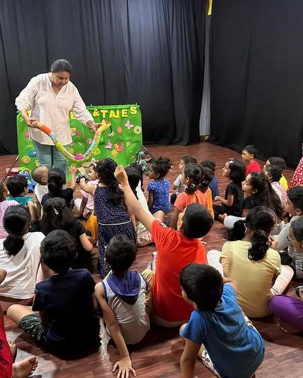 A room full of engaged children at a summer fun event. My puppet shows are designed to be interactive, getting kids to participate in the story.
