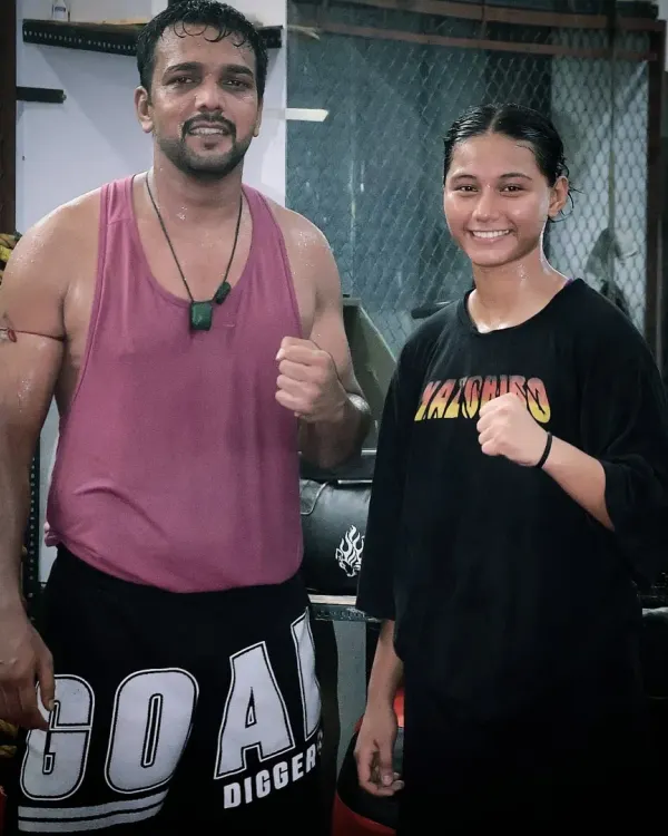 Posing with one of my dedicated female fighters after a tough training session. The attitude and hard work here are inspiring.