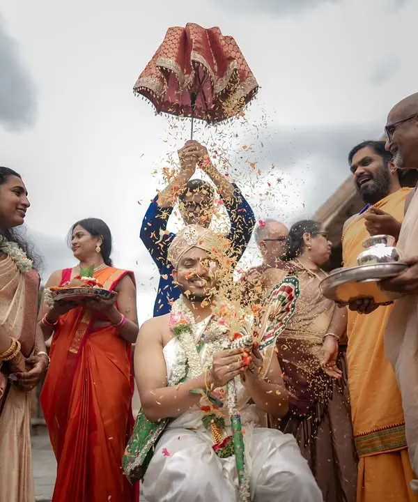 The Kashi Yatra is a beautiful and symbolic ritual. I captured the energy of the moment, with rice showering the groom, surrounded by his smiling family under a dramatic sky.