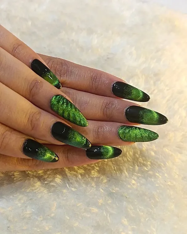 This stunning green and black cateye effect on long stiletto extensions is perfect for making a bold statement. The magnetic polish creates a deep, shifting shimmer that catches the light beautifully, showing the kind of unique, high-impact nail art I love to create.