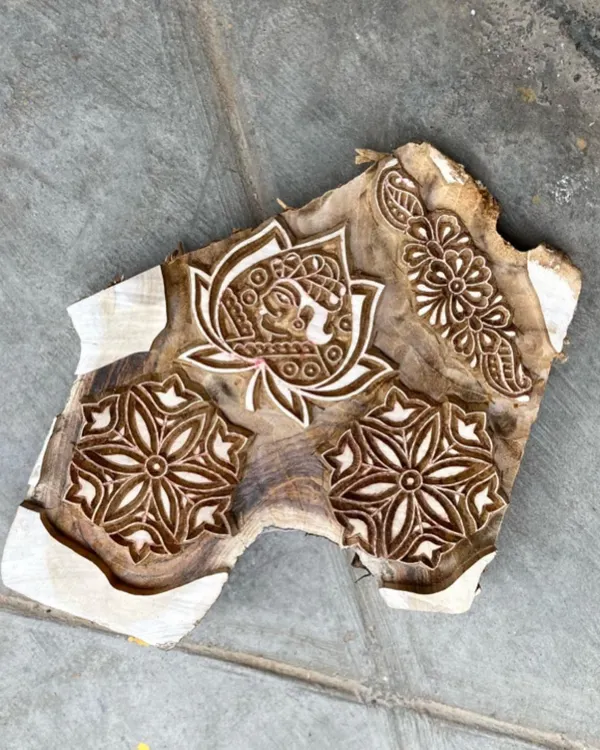 We believe in minimal wastage at every stage. This single piece of seasoned teak wood is carved with multiple designs, a testament to the skill and resourcefulness of our artisans. These blocks are built to last for generations.