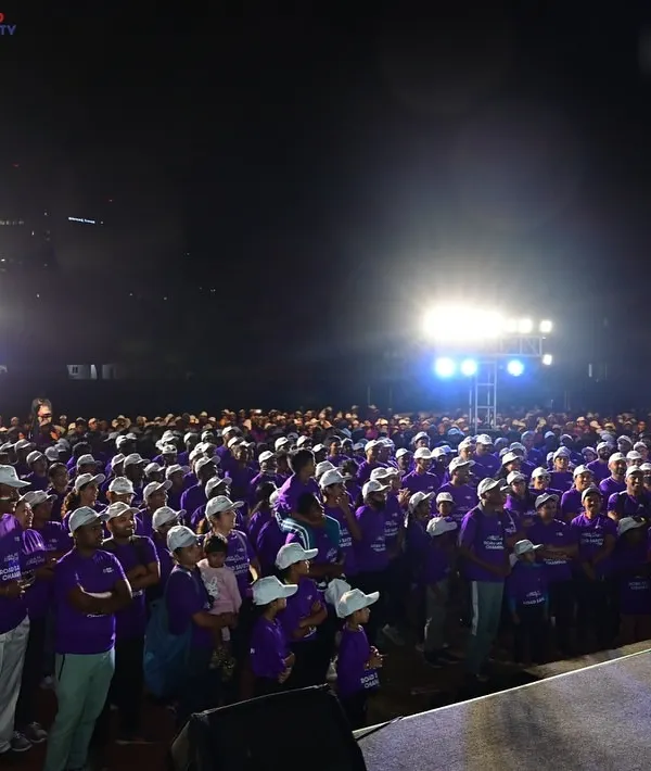 Commanding the stage and connecting with a massive, energetic crowd at the Safe-A-Thon in Kanteerava Stadium. This is where I feel most alive, turning a large audience into a unified, engaged community.
