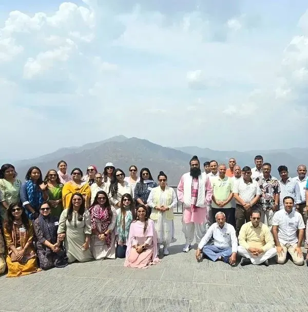 Our happy group of spiritual seekers during the Himachal Pradesh retreat, with the majestic mountains providing a powerful backdrop for our soul journey.