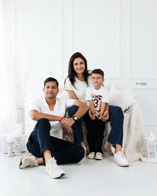 A classic family portrait in my bright, minimalist studio. I love capturing these simple, happy moments with everyone coordinated in timeless whites and denim.