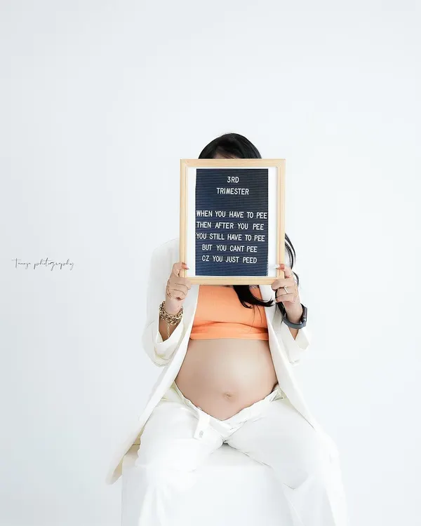 A fun and relatable take on the third trimester. This creative shot with a letter board adds a touch of humor and personality to the maternity session.