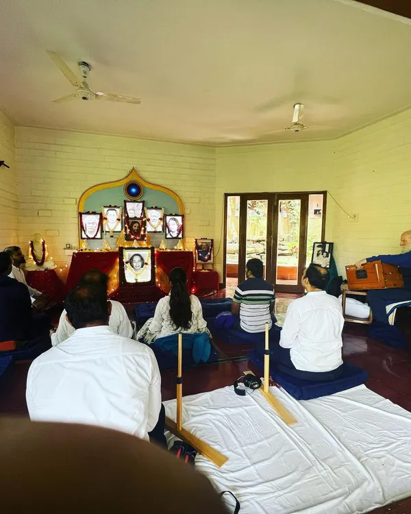 Devotees absorbed in a blissful Christmas meditation at our Ananda Bangalore Retreat. The serene environment and collective focus help each person to dive deep into the silence and feel the presence of Christ consciousness.