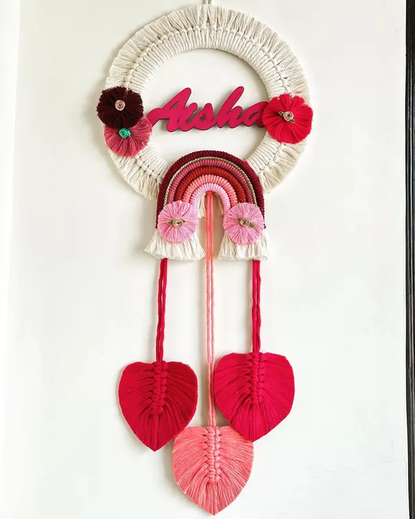 I adore making personalized gifts, and this name hanging for Aisha was a joy to create. Combining a custom nameplate with a rainbow and delicate macrame leaves makes for a perfect nursery decoration.