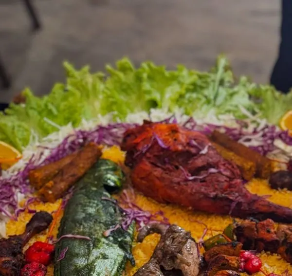 A colourful and appetizing platter of our mixed starters, featuring a variety of kebabs and grilled items. This is how I present food to make your event's main table look spectacular.