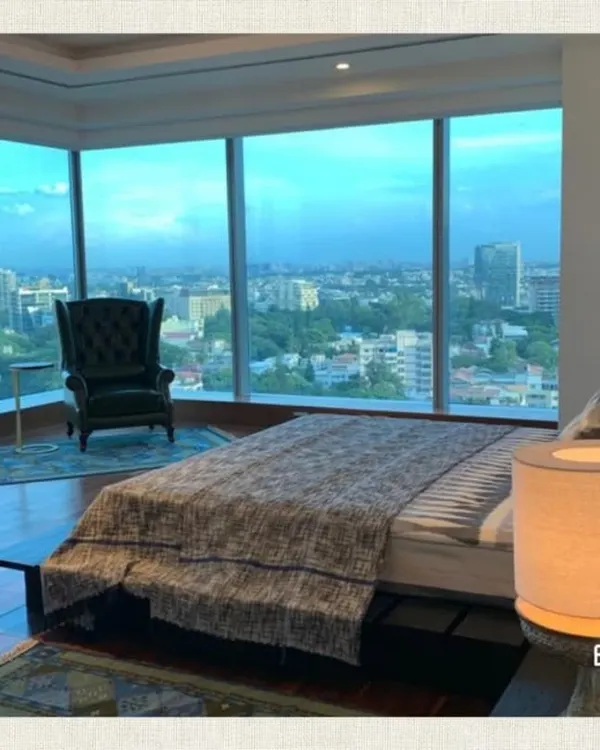 We believe a home should be your personal sanctuary, especially when it comes with a breathtaking city view. This master bedroom design focuses on creating a luxurious yet comfortable retreat, with rich wood flooring and a layout that maximizes the stunning panoramic windows.