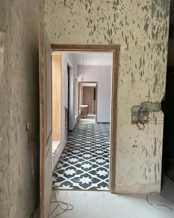 This is where it all begins. A raw site, with unfinished walls and floors, holds all the potential for what's to come. This home needed love, and this image captures the very start of its transformation journey.