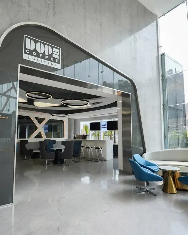 An establishing shot for a commercial project with Architect Reza Kabul, capturing the striking entrance of Dope Coffee Roasters. My goal here was to create a powerful first impression, highlighting the modern, futuristic archway and giving a glimpse of the sleek interior waiting inside.