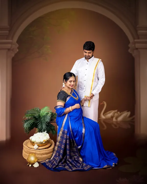 A stunning fine-art maternity portrait inspired by classic paintings. The rich blue saree and traditional South Indian attire create a regal and timeless image.