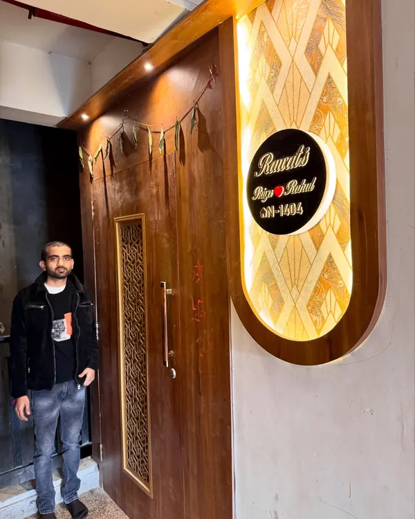A grand entrance for a home at Amrapali Princly Estate. I designed this custom door and the backlit nameplate to create a welcoming and impressive entryway.