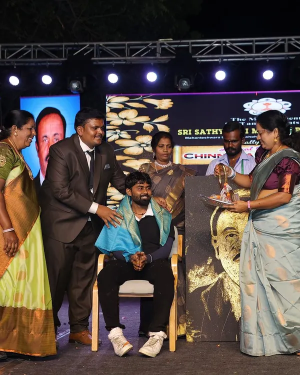 A moment of felicitation after a live painting performance. It is always an honor to be recognized for my work, especially when I can share it with a wonderful audience.