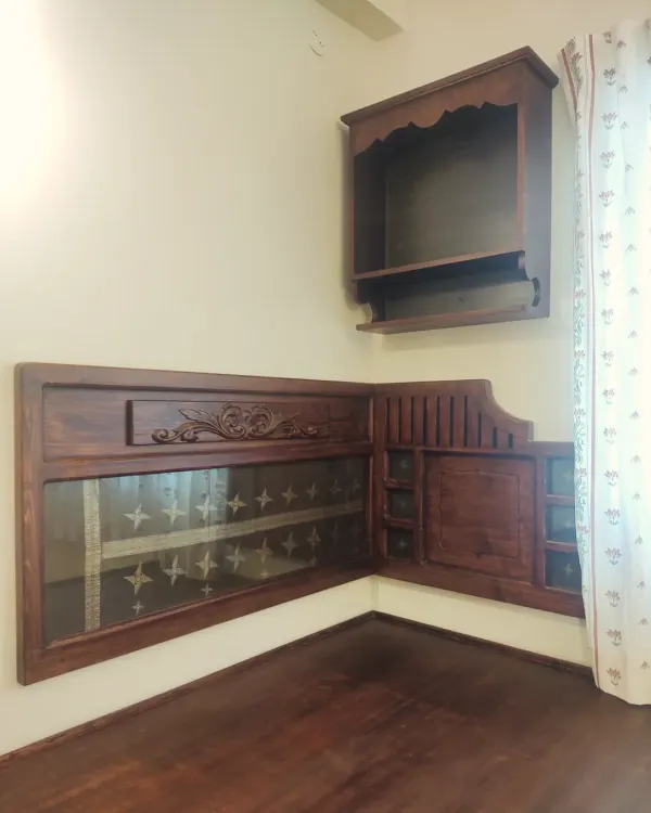 We believe furniture should be a part of your legacy. For this special room, we integrated our client's cherished family sari into the very structure of the headboard, preserving a precious memory under glass. This is what we mean when we say we build furniture with a soul.