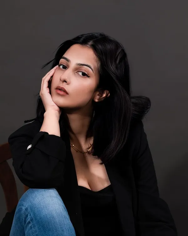 An on-model portrait showcasing a delicate necklace. This type of lifestyle jewelry photography helps customers envision themselves wearing the piece and understand its scale and style.