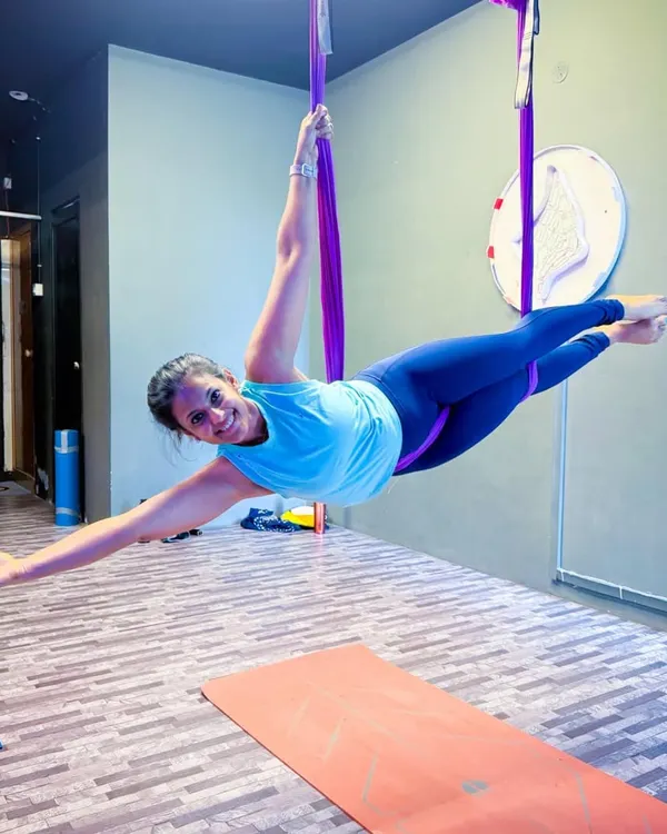 This is the feeling of pure freedom that Aerial Yoga gives you. Using the hammock to fly, I feel weightless and strong, smiling through the entire practice. It’s a moment of sukoon, or peace, found in the air.
