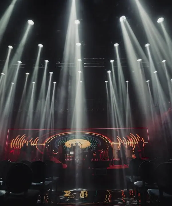 To achieve a simple yet dramatic look for this Sangeet, we used 92 super sharpy lights to create this incredible impact. The all-black suede chairs and mirror flooring completed the moody, sophisticated atmosphere.