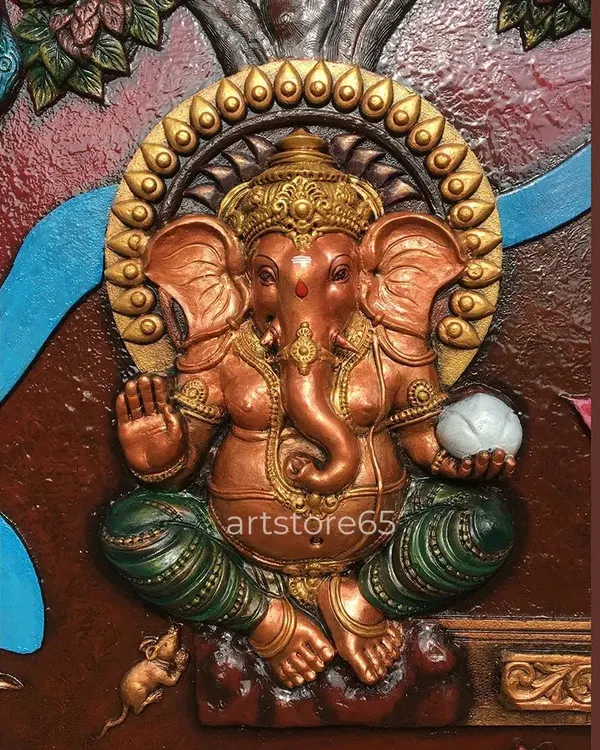 This close-up of a Ganesha sculpture shows the warm, metallic finish and detailed craftsmanship. We focus on creating a divine presence, capturing details like the modak in his hand and the serene expression, making it a perfect centerpiece for worship.