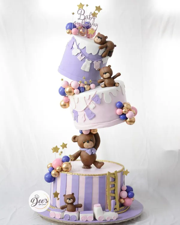 This gravity-defying topsy-turvy cake was a dream to create for a special baby shower. I love pushing the boundaries of cake design, and this piece, with its hand-sculpted teddy bears and playful structure, shows how we can make any celebration magical.