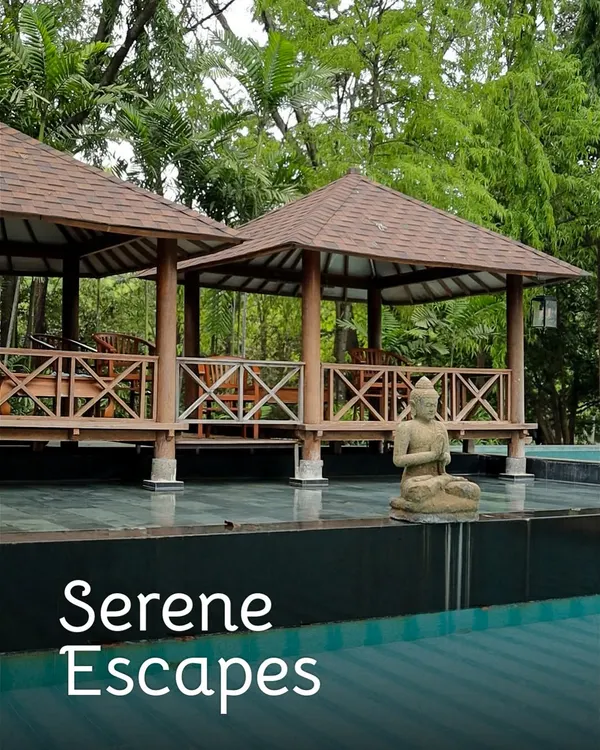 Our serene poolside at Nandi Hills, complete with gazebos and a Buddha statue, is the perfect place to find your peace.