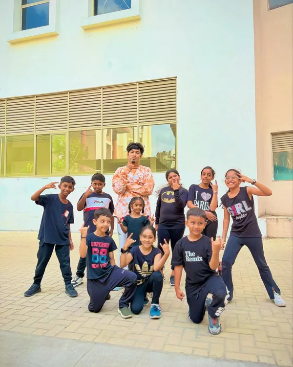 Our kids' batch posing with their instructor after a great class. We're always working on something new and exciting for them to perform.