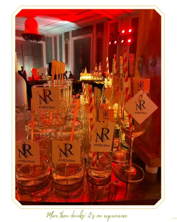 Custom glassware for an event, featuring tags with the personalized hashtag #NRvibes. This is a simple yet effective way to brand an event.