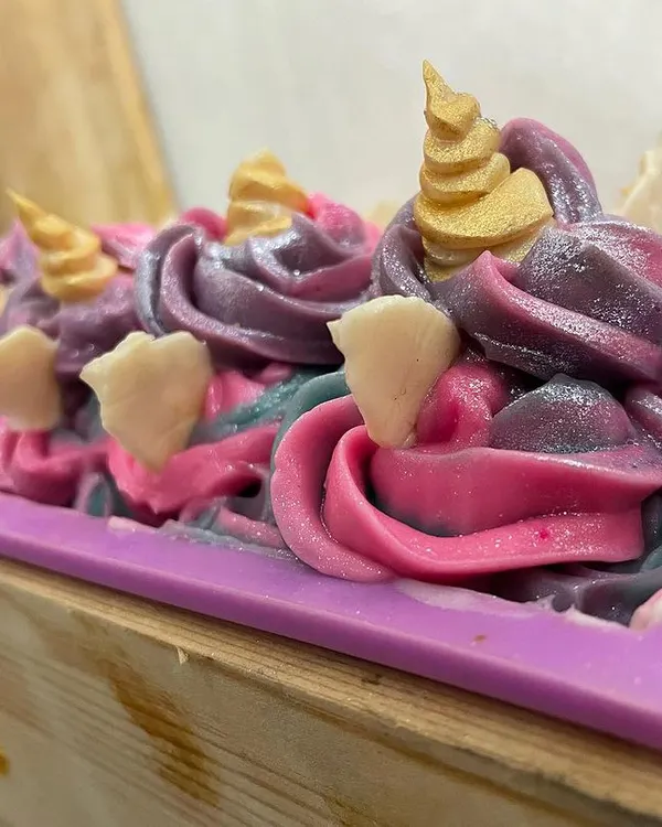 This is my Unicorn Soap, made with organic oils and plant-based butters. It's crafted using the cold-process method and looks just like a little cupcake, making it a perfect, fun gift.