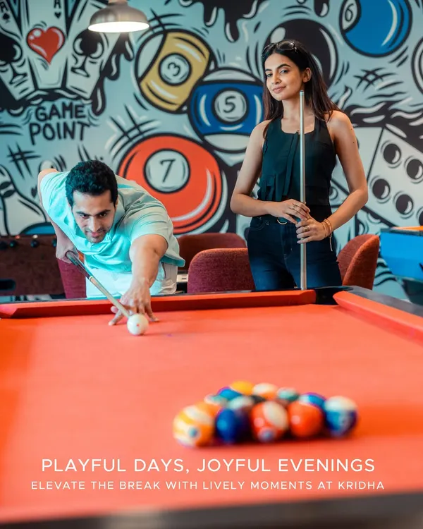 Playful days, joyful evenings. Our recreation zone, Kridha, offers a lively space for friendly competition with a game of pool on our vibrant red table.