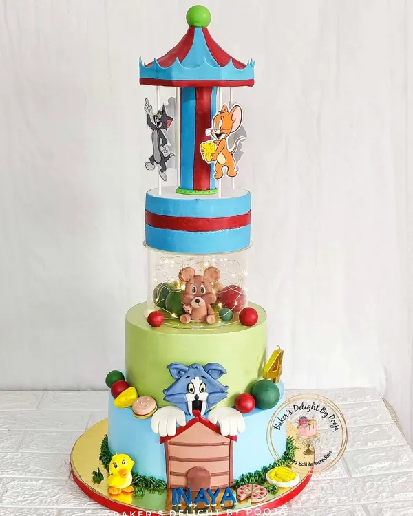A truly special creation, this Tom & Jerry cake features a rotating carousel with lights. This multi-tiered design brings the classic cartoon to life with playful scenes and characters, making it a showstopper for a memorable birthday.
