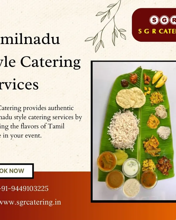 A beautifully arranged Tamil Nadu style sadhya on a banana leaf. This overhead shot shows the variety of dishes, including rice, appalam, poriyals, and curries in bowls, that make up an authentic feast.