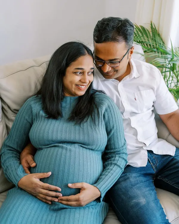 A happy, candid moment shared on the sofa. Home sessions allow for this kind of relaxed intimacy, where you can just be yourselves while I capture the connection between you.