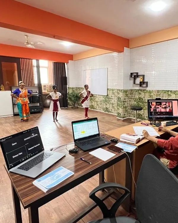 A view of our hybrid classroom where students are present both physically and virtually. Our technology setup allows for seamless interaction between the guru and all students, regardless of their location.