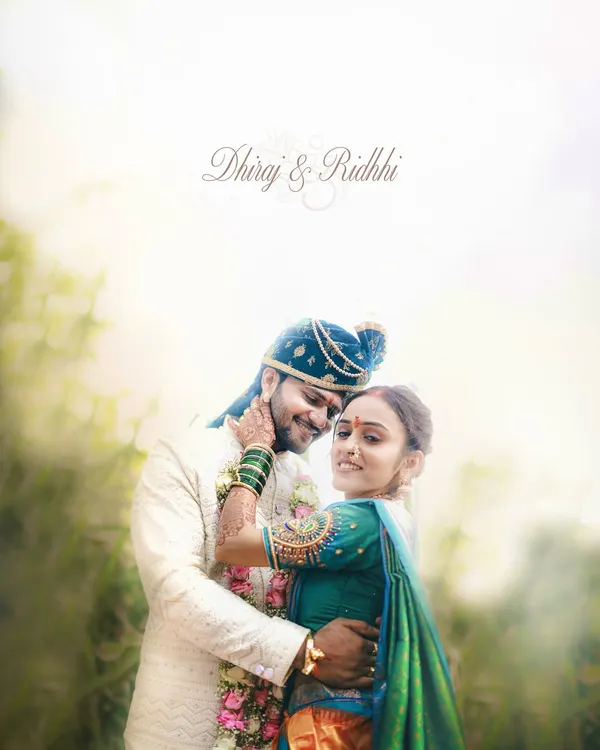 An ethereal and romantic portrait of a Maharashtrian couple on their wedding day. The soft lighting and gentle embrace create a dreamy, timeless feel.